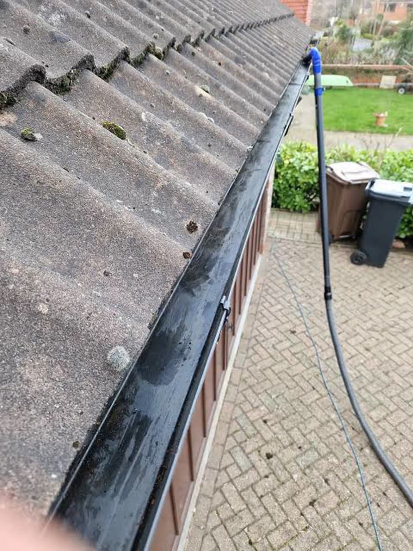 Pole-fed gutter clearance from the ground — no need to come up on the roof.