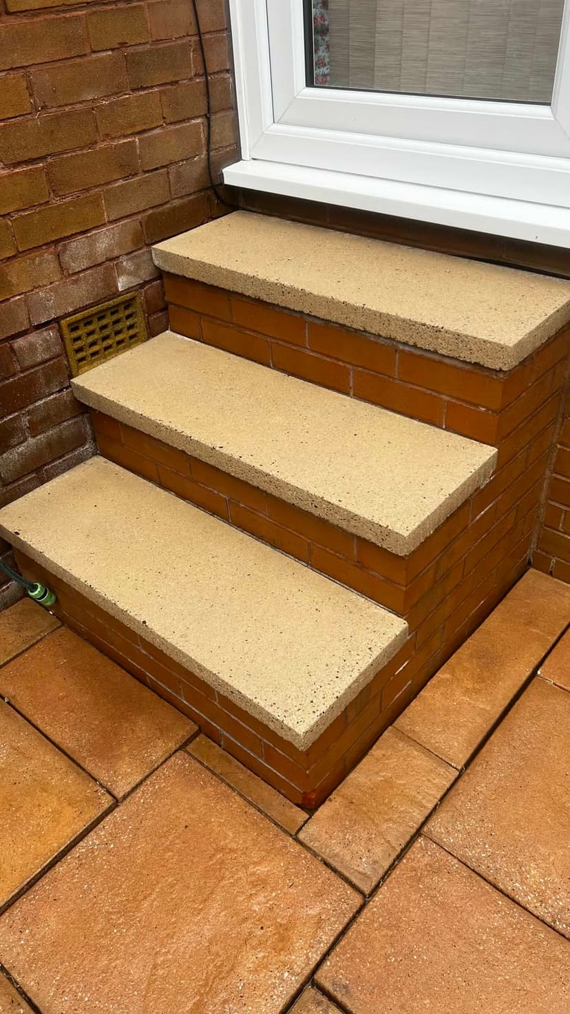 Cast steps cleaned back to a fresh, pale finish.