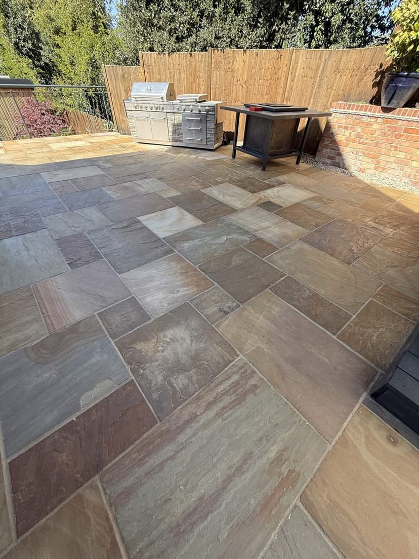 The same patio from the seating area — clean stone and crisp joints.
